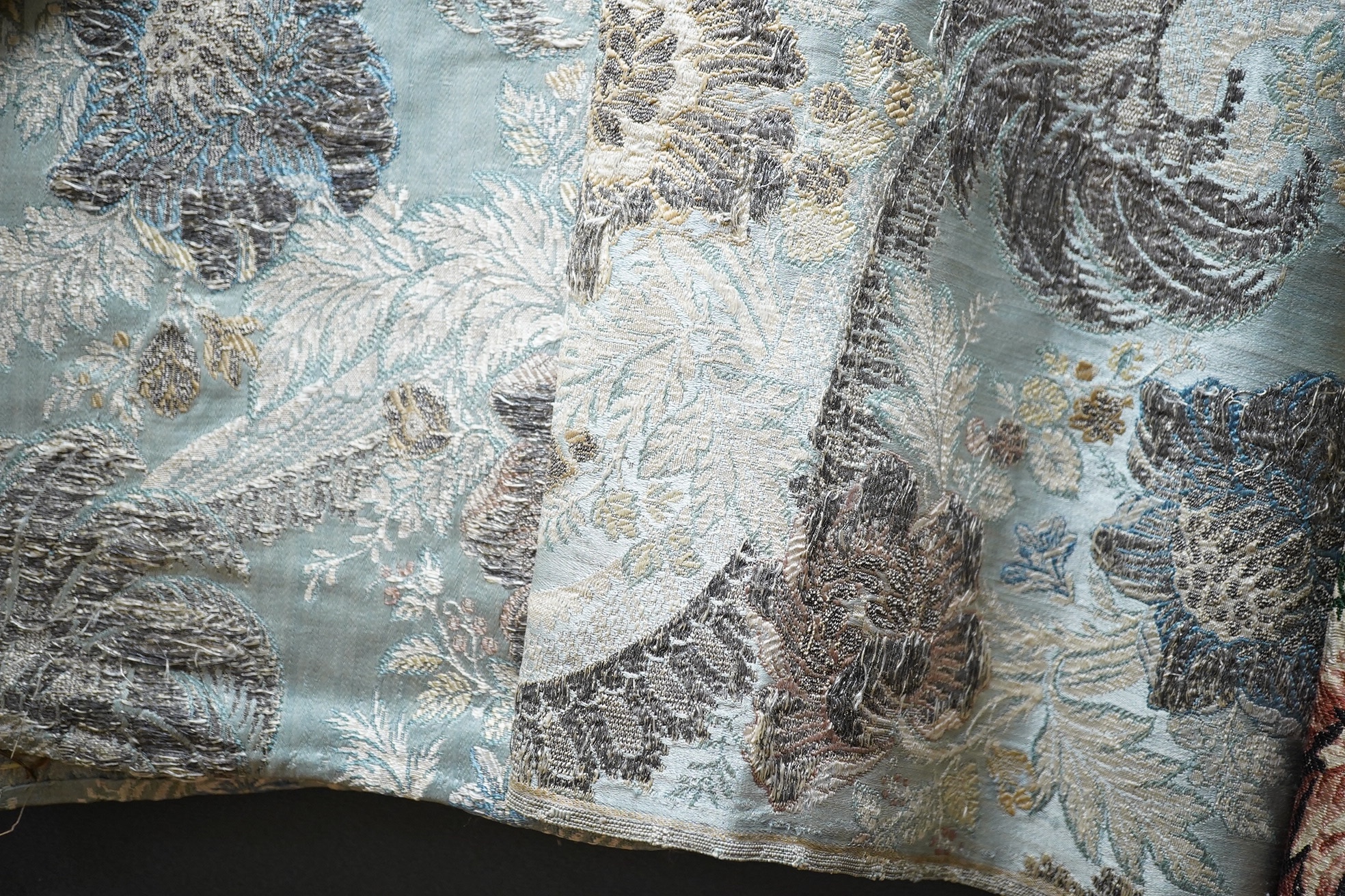 Samples of 18th century French, possibly Lyon silk, short loom brocades including two pairs and three single samples of varying sizes, one pair multi polychrome of large exotic flowers and fruits, the other pair pale blu